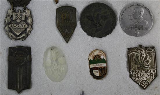 A collection of thirty two Hitler Youth pin badges and other day badges,